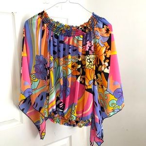 Woman’s multi colored top with elastic waist and bell sleeve size 10/12